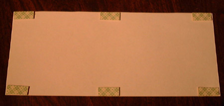 Small pieces of tape applied to the back of a paper diffuser